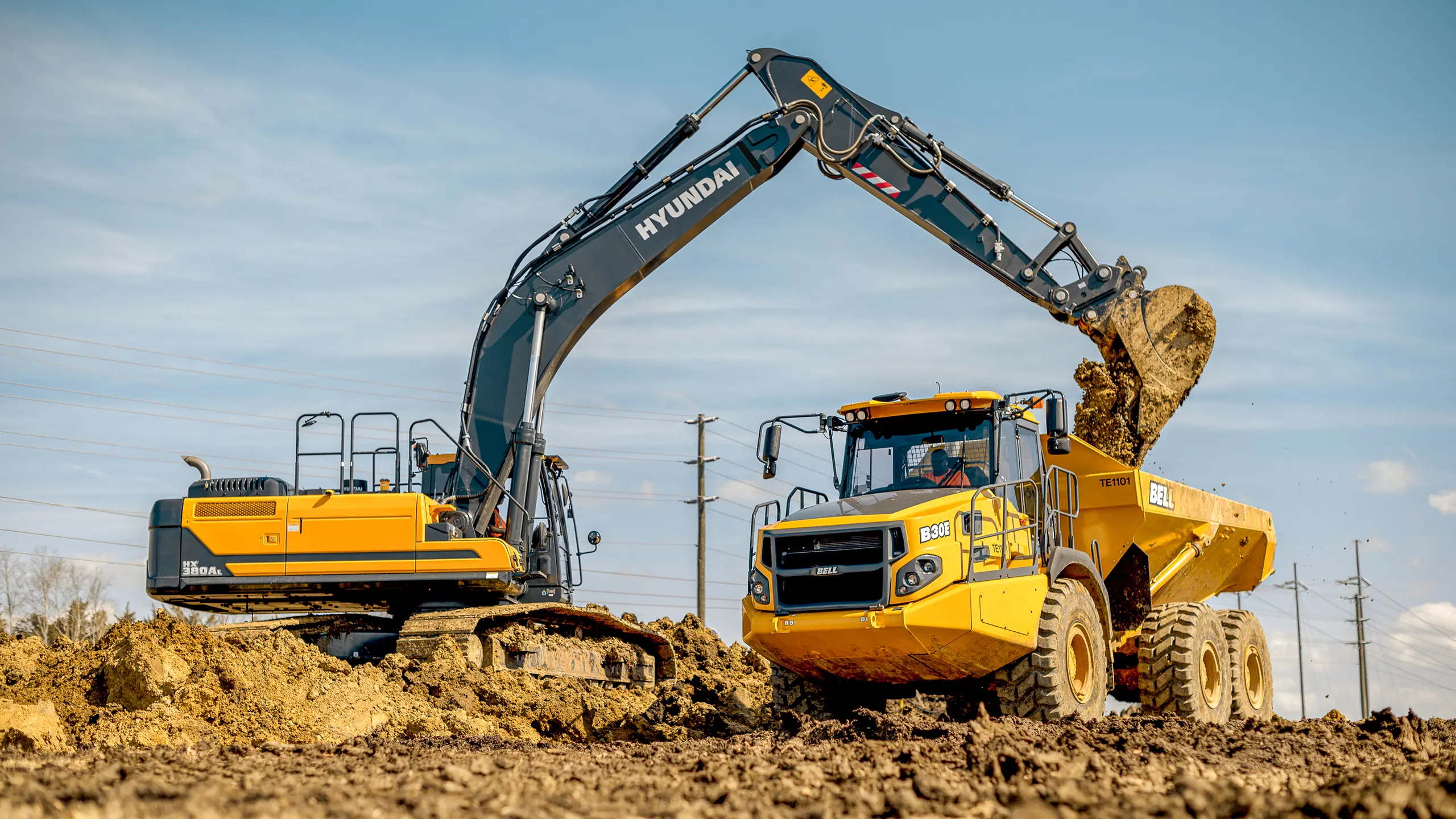 Taylor Construction Equipment Excavator and Articulating Dump Truck